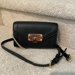 Michael Kors black crossbody/convertible clutch. Beautiful condition.